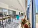 Covered patio with an outdoor kitchen, seating, and ceiling fans at 3752 Fox Dale Ln, Holiday, FL 34691