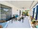 Covered patio area with ceiling fans, seating, and plants at 3752 Fox Dale Ln, Holiday, FL 34691