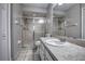 Bright bathroom with a glass-enclosed shower and tile flooring at 4030 Casa Del Sol Way, New Port Richey, FL 34655