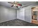 Bedroom with plush carpet, closet with white doors, and en-suite bathroom access at 4030 Casa Del Sol Way, New Port Richey, FL 34655