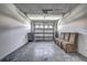 Spacious garage with ample storage space and seating area at 4030 Casa Del Sol Way, New Port Richey, FL 34655