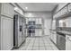 Well-lit kitchen features stainless steel appliances and white cabinetry at 4030 Casa Del Sol Way, New Port Richey, FL 34655