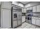 Bright kitchen features stainless steel appliances and granite countertops at 4030 Casa Del Sol Way, New Port Richey, FL 34655