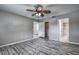 Spacious main bedroom with ceiling fan, closet, and bathroom access at 4030 Casa Del Sol Way, New Port Richey, FL 34655