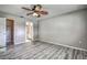 Spacious main bedroom with ceiling fan, closet, and bathroom access at 4030 Casa Del Sol Way, New Port Richey, FL 34655