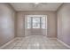 Neutral room with a large window providing ample natural light at 4030 Casa Del Sol Way, New Port Richey, FL 34655