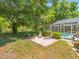 Serene backyard with a patio, chaise lounges, and a screened pool, creating a perfect oasis for relaxation and recreation at 446 Romine Ct, Spring Hill, FL 34609