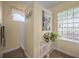 Bright bathroom featuring a glass block window, tile flooring, and a separate shower at 446 Romine Ct, Spring Hill, FL 34609