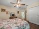 Bedroom featuring a floral bedspread, dresser, and carpeted floor at 446 Romine Ct, Spring Hill, FL 34609