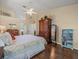 Bedroom featuring a bed, vaulted ceiling, and wood-look floors at 446 Romine Ct, Spring Hill, FL 34609