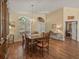 Elegant dining room featuring a large table and hardwood floors at 446 Romine Ct, Spring Hill, FL 34609