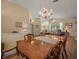 Dining room with hardwood floors adjacent to the living room at 446 Romine Ct, Spring Hill, FL 34609