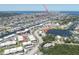 Expansive aerial view of residential area featuring waterfront access, canals, and recreational amenities at 4726 Marine Pkwy # 201, New Port Richey, FL 34652