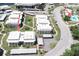 Aerial view showcasing the property's building, parking, pool, and surrounding landscape at 4726 Marine Pkwy # 201, New Port Richey, FL 34652