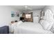 Serene bedroom featuring a bed, dresser, and access to a balcony for a relaxing retreat at 4726 Marine Pkwy # 201, New Port Richey, FL 34652