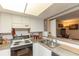 Cozy kitchen with white cabinets and black and white appliances, perfect for cooking delicious meals at 4726 Marine Pkwy # 201, New Port Richey, FL 34652