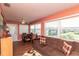 Inviting living area with a comfortable sofa, adjacent dining set, and bright natural light at 4726 Marine Pkwy # 201, New Port Richey, FL 34652