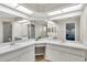 Bathroom with dual sinks, vanity, ample counter space, and tiled floors at 4837 Prince George Cir, New Port Richey, FL 34655