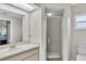 Bathroom featuring glass door shower and sink vanity at 4837 Prince George Cir, New Port Richey, FL 34655