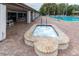 Community hot tub and seating adjacent to the pool, perfect for unwinding and socializing at 4837 Prince George Cir, New Port Richey, FL 34655