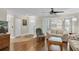 Comfortable living room with hardwood flooring, lots of light, and bay window at 4837 Prince George Cir, New Port Richey, FL 34655