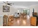 Spacious living area featuring beautiful hardwood floors and lots of room for lounging and dining at 4837 Prince George Cir, New Port Richey, FL 34655
