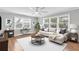 Comfortable living room with hardwood floors, lots of natural light, and neutral colors at 4837 Prince George Cir, New Port Richey, FL 34655