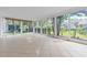 Enclosed sunroom with sliding glass doors that open to the yard at 4837 Prince George Cir, New Port Richey, FL 34655