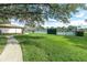 Well-kept tennis courts in a lush green setting, providing a recreational amenity for active community members at 4837 Prince George Cir, New Port Richey, FL 34655