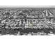 Monochrome aerial view of waterfront homes, docks, and boats in a residential neighborhood at 5106 Blue Heron Dr, New Port Richey, FL 34652