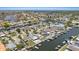 Beautiful aerial view of waterfront homes and canals, showcasing docks and boats along the water at 5106 Blue Heron Dr, New Port Richey, FL 34652