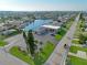 A high angle aerial shot captures the property surrounded by a well-maintained landscape and ample parking at 5106 Blue Heron Dr, New Port Richey, FL 34652