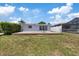 Backyard with brick patio, grass and lush landscaping at 5106 Blue Heron Dr, New Port Richey, FL 34652