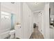 Hallway bathroom with a shower-tub combo, white vanity, and access to the bedroom at 5106 Blue Heron Dr, New Port Richey, FL 34652