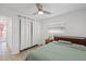 Bedroom featuring a fan, closet, and a window with a view at 5106 Blue Heron Dr, New Port Richey, FL 34652