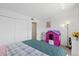 Cozy bedroom offering a play area, ample closet space, and serene ambiance at 5106 Blue Heron Dr, New Port Richey, FL 34652