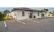 Exterior of commercial building with parking lot and well-maintained landscaping, offering convenient access at 5106 Blue Heron Dr, New Port Richey, FL 34652