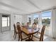Dining room with lots of natural light and a view of the water, creating a peaceful atmosphere at 5106 Blue Heron Dr, New Port Richey, FL 34652