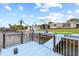 Beautiful waterfront home featuring a blue dock with boat lifts, lights, and a green kayak at 5106 Blue Heron Dr, New Port Richey, FL 34652