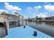 Waterfront view of private boat lift and dock on the canal at 5106 Blue Heron Dr, New Port Richey, FL 34652
