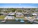 Waterfront home with a dock, boat, and inviting outdoor space for relaxation and recreation at 5106 Blue Heron Dr, New Port Richey, FL 34652