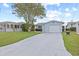Charming single-story home features an attached garage and a well-manicured front lawn, creating a welcoming curb appeal at 5106 Blue Heron Dr, New Port Richey, FL 34652