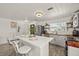 Bright kitchen with a center island, stainless steel appliances, and wood countertops at 5106 Blue Heron Dr, New Port Richey, FL 34652