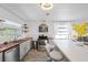 Bright kitchen featuring a breakfast bar, stainless steel appliances, and an open design at 5106 Blue Heron Dr, New Port Richey, FL 34652