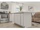 Modern kitchen features stainless steel appliances, a gas stove and a center kitchen island at 5106 Blue Heron Dr, New Port Richey, FL 34652