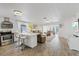 Open-concept kitchen featuring a large island, modern appliances, and seamless flow to living areas at 5106 Blue Heron Dr, New Port Richey, FL 34652