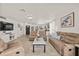 Spacious living room with recessed lighting, an entertainment center, and comfortable seating at 5106 Blue Heron Dr, New Port Richey, FL 34652