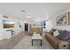 Bright living room featuring neutral colors, wood-look tile floors and lots of space at 5106 Blue Heron Dr, New Port Richey, FL 34652
