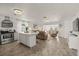 Open concept living space showcases the kitchen, living room, and dining room at 5106 Blue Heron Dr, New Port Richey, FL 34652