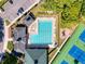 Aerial view of community pool, tennis courts, and playground at 5198 Legend Hills Ln, Brooksville, FL 34609